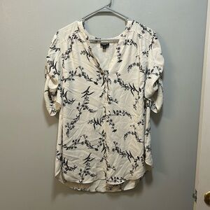 Cream blouse with black floral pattern from Torrid. Size 2/18-20.